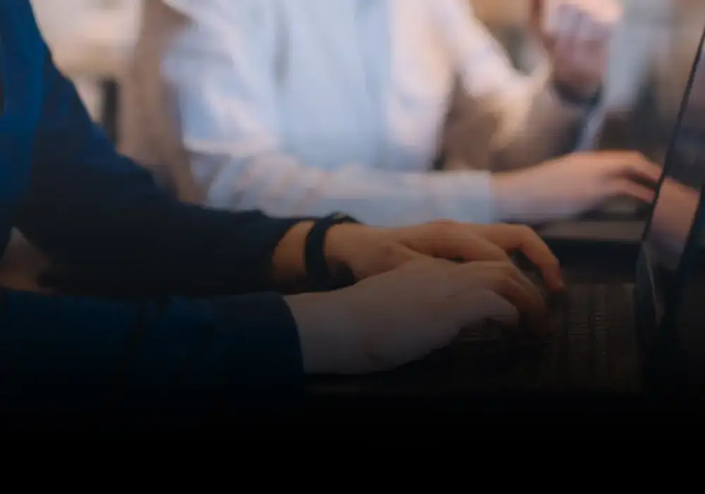 Hands on a keyboard during a development session